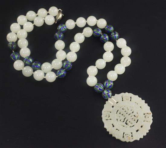 A celadon jade and two colour enamel bead necklace with carved jade pendant, 32in.